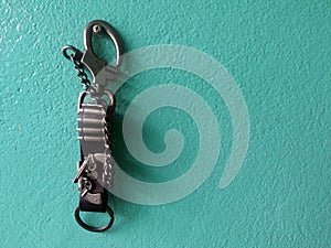 key chain leather on green wall concrete