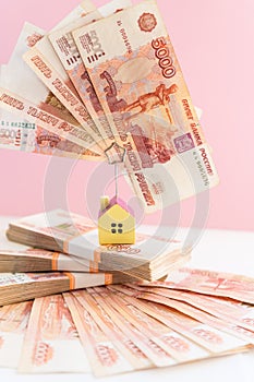 Small house model is above russian rubles, the concept of home buying and selling.The concept on the search and purchase