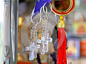 Key chains with catholic religious symbols in a pious articles shop