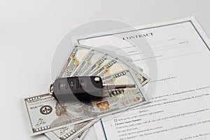 Key and contract on a table. Car purchase or insurance concept