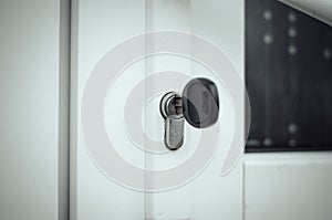 The key is in the door lock of the white front door. Buying a new home