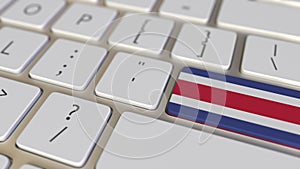 Key with flag of Costa Rica on the computer keyboard switches to key with flag of China, translation or relocation