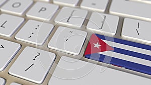 Key with flag of Cuba on the computer keyboard switches to key with flag of Great Britain, translation or relocation