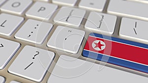 Key with flag of North Korea on the computer keyboard switches to key with flag of the USA, translation or relocation