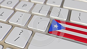 Key with flag of Puerto Rico on the computer keyboard switches to key with flag of France, translation or relocation