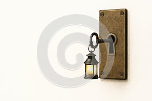 A key with a flashlight in the keyhole. Space for text.