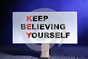 KEY Keep believing yourself, text words typography written on paper, life and business motivational inspirational