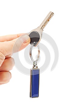 Key with a keychain in the hand