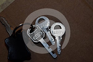 Key with keyholder in brown background