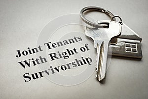 Key lie on paper with a mark Joint tenants with right of survivorship.