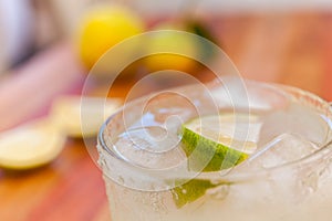 Key lime margarita garnished with fresh lime in a glass