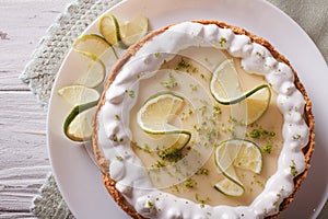 Key lime pie with whipped cream close-up. Horizontal top view