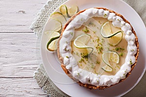 Key lime pie with whipped cream. Horizontal top view