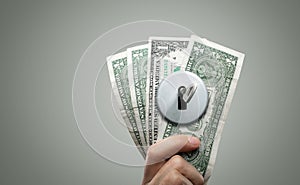 Key in a Lock on Dollar Bills - Financial Concept