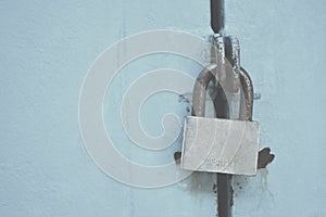 Key lock the door on blue tone background