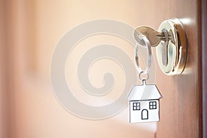 A key in a lock with house key