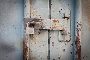 Key locker at rusty steel door