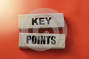 Key Points on cube wooden blocks on red. Business management concept