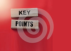 Key Points on cube wooden blocks on red. Business management concept.