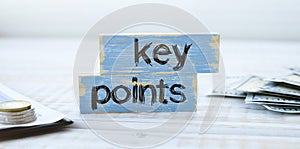 Key Points on cube wooden blocks on wooden background. Business success measurement target concept.