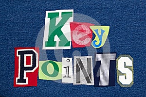 KEY POINTS text word collage colorful fabric on denim, presentation summary photo