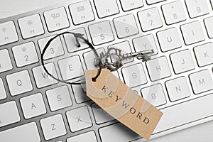 Key with tag KEYWORD on computer keyboard , top view