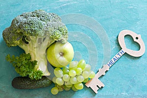 Key to health. Vegetables and fruits with key