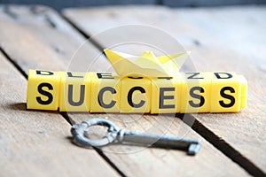Key to success concept. Lettering from yellow cubes