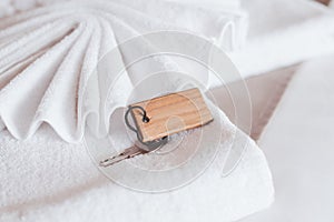 key on towel with blank empty wood label,Copy space for text