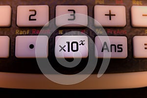 Key x10 on the keyboard of a scientific calculator