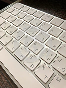 Keyboard. Backlit computer keyboard closeup. Hi tech concept