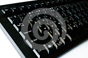 Keyboard. Black keyboard The buttons on the keyboard. Typing. Printed text. Alphabet. Computer keyboard