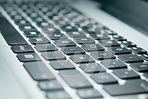 Keyboard with black keys in grey background