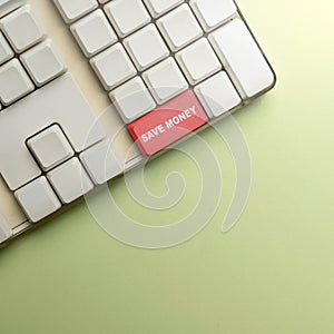 Keyboard button with 'save money' text