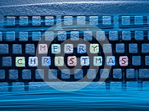 Keyboard colored buttons with words Merry Christmas