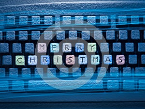 Keyboard colored keys with words Merry Christmas