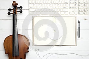 Keyboard computer notebook dvd disc and violin