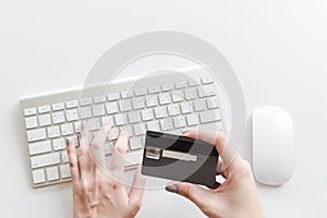 Keyboard hand hold credit card and mouse on table write