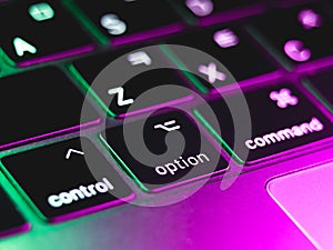 The keyboard key option with pink end green light