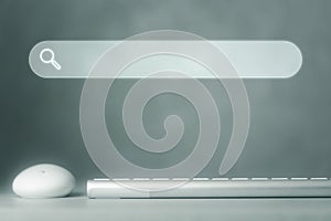 Keyboard and mouse computer on table in office with searching browsing bar