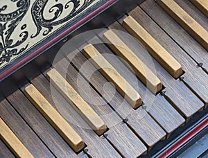 Keyboard of old harpsichord with brown keys
