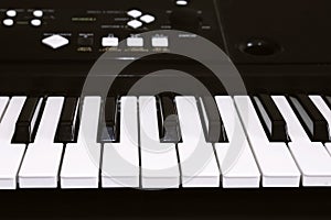 Keyboard or piano for digital music recording, a music instrument background, music concept. A photo of old used synthesizer, elec photo