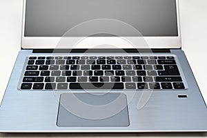 Keyboard of portable computer laptop with English layout and touchpad for working and writing text