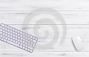 Keyboard purple keys white wooden background angle copy space mouse minimal