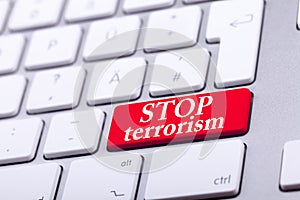 Keyboard with red button and stop terrorism word on it