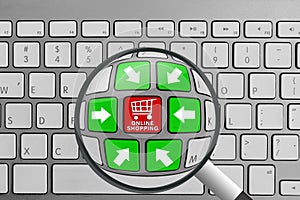 Keyboard with red and green online shopping theme buttons and magnifying glass