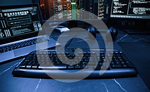 Keyboard and screens. Cyber criminal haker dark room for massive attack of corporate big data servers photo