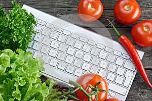 Keyboard and vegetables. Online recipe search.