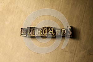 KEYBOARDS - close-up of grungy vintage typeset word on metal backdrop