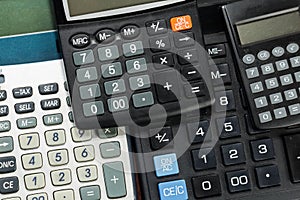 Keyboards of different electronic calculator, fragment top view close-up